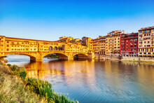 Golden Sunset Over Ponte Vecchio Bridge With Reflection In Arno River, Florence