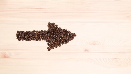  Wooden craft surface as a comfortable background wall or floor with different structures of light wood full of many aroma coffee beans. Cupid straw shaped coffee beans. For coffee lovers.