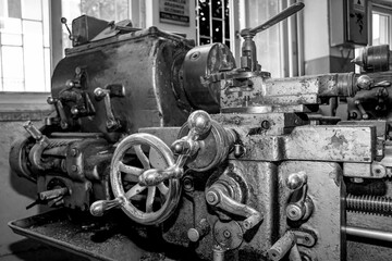 Wall Mural -  Metalworking workshop, metal processing machines.  Vintage Industrial Machinery in a old factory - black and white photo