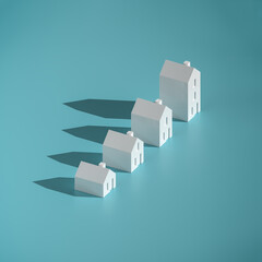 Wall Mural - which size of house can you afford? concept: four differently sized models of houses on turquoise ba
