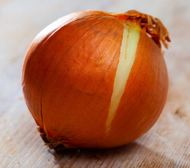 Wall Mural - Image of onion bulbs on wooden background, nobody