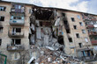 War in Ukraine. The building is seen damaged after it was hit by a missile during the battle of Hostomel. Urban warfare.