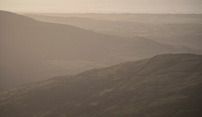 Wall Mural - Murky mountain scene with coastal background in Snowdonia national park