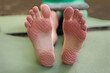 © Drimarondo - Young womans feet after standing on sadhu board (yoga board) with clean legs and background
