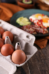 Canvas Print - Breakfast with fried eggs with tomato, bacon and avocado