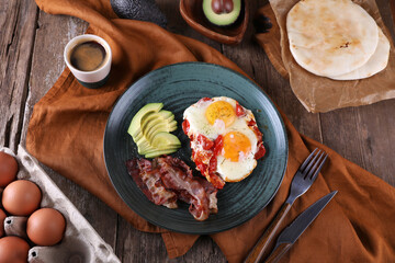 Canvas Print - Breakfast with fried eggs with tomato, bacon and avocado