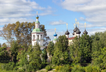 Ancient medieval Russian church on the bank of the river