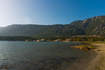 AKYAKA, MUGLA, TURKEY: Landscape with a view of the sea, beach, mountains and the village of Akyaka on a sunny day