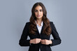 Portrait of successful business woman in suit on gray isolated background. Serious office female worker, manager employees. Female employee young secretary.