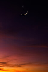 Wall Mural - crescent moon on dusk sky twilight vertical symbol religion of islamic with free space for text eid 