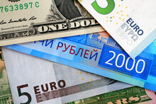 Macro Top View On Various Dollar, Euro And Rouble Banknotes