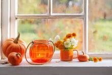 Autumn Flowers And Pumpkins  On Old White Windowsill