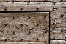 Detail Of A Very Old Door Studded With Iron Nails.