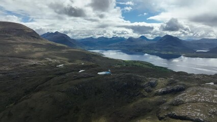 Wall Mural - Aerial view of the landscape surrounding Diabaig, Lower Diabaig and Torridon village in the north west highlands of Scotland during summer on a blue sky day with light clouds