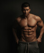 © Serge Lee - Shirtless sexy muscled male model standing in studio