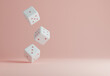 Three falling white dice on a pastel pink background. 3D minimal template