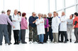 © ASDF - Group Of Mature People And Doctors Indoors Full Length