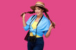 © khmelev - Tourism concept. Excited young caucasian woman tourist with photo camera, isolated on pink background. Female student hipster in casual clothes and straw hat