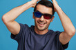 © SHOTPRIME STUDIO - handsome man 3D glasses cinema fun emotions blue background