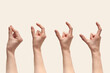 Set of female hands with measuring gesturing on beige.