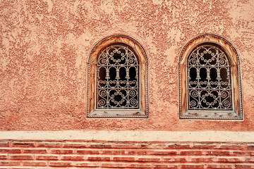 Wall Mural - The wall of building with two vintage windows.