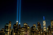 The Tribute in Light shines 4 miles into the sky from Lower Manhattan, with the One World Trade Center, the Freedom Tower, to the right