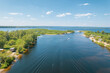 Aerial landscape view on Volga river with islands and green forest. Picturesque panoramic view from the height on the touristic part of the Volga river near Samara city at summer sunny day.