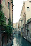 Fototapeta Uliczki - Moody day in the city of Venice in Italy. Beautiful renaissance buildings. 