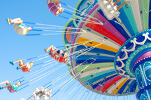 Blurred Imaged Of Colorful Summer Carnival Ride