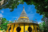Fototapeta Paryż - Background of religious sights on high mountains in Hat Yai District of Thailand (Phra Maha Ruesee Chedi Tripob Trimongkol) is a beautiful stainless steel pagoda, tourists always come to make merit du