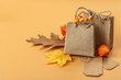 Black Friday Sale concept. Shopping paper bags, handmade tags, fall oak leaves, autumn decor