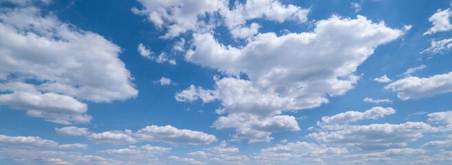 Canvas Print - white clouds in blue summer sky panoramic background