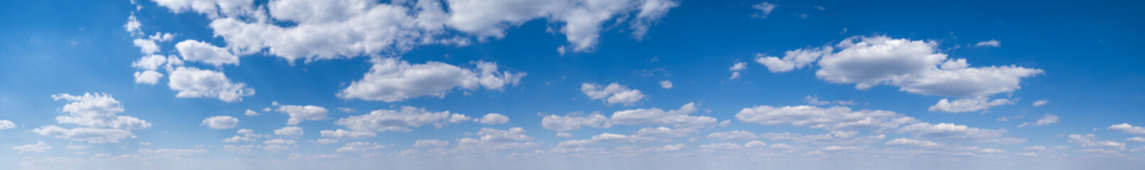 Wall Mural - white clouds in blue summer sky panoramic background