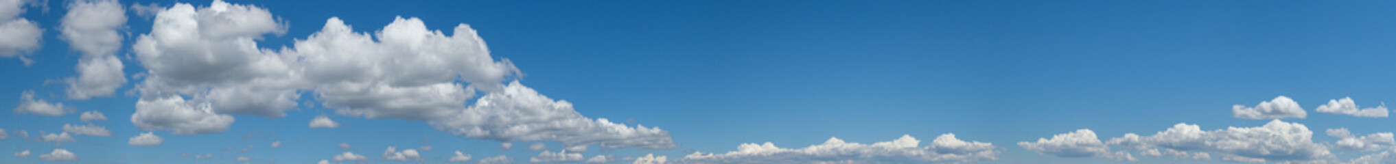 Canvas Print - white clouds in blue summer sky panoramic background