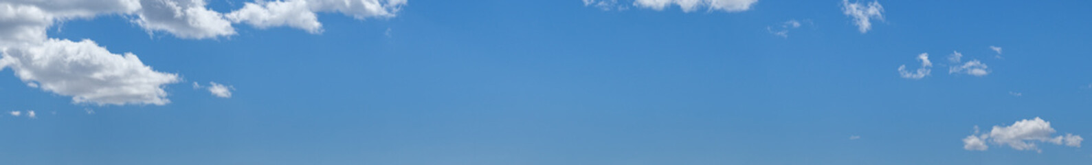 Canvas Print - white clouds in blue summer sky panoramic background