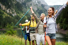 Adventure, Travel, Tourism, Hike And People Concept. Group Of Happy Friends With Backpack Outdoors