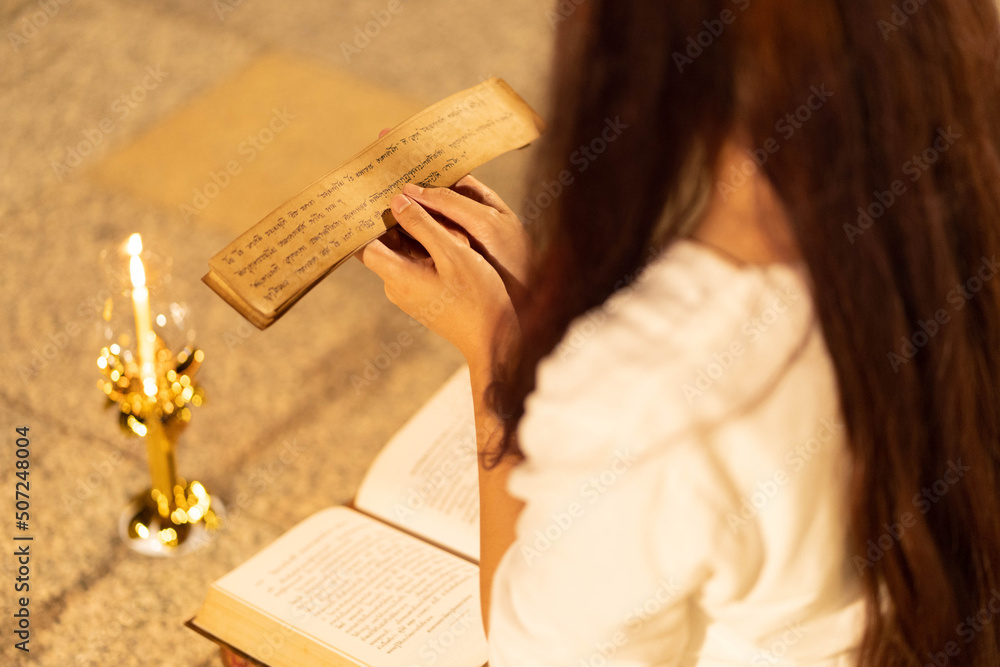 Reading Sandscript Asia woman wearing traditional dress of Thailand reading Sanskrit ...