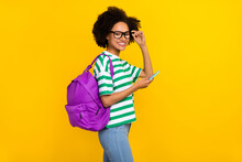 Profile Photo Of Good Young Brunette Lady Hold Telephone Wear Eyewear T-shirt Jeans Bag Isolated On Yellow Background