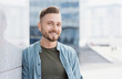 © kite_rin - Handsome young student man on city street, Closeup portrait of cheerful businessman looking at camera and smiling
