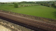 Drone Shot Above Arthington Viaduct Train Tracks And Surrounding Green Countryside Near Harrogate In Yorkshire, UK
