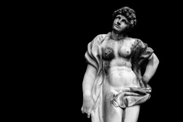  Antique Olympic goddess of love and beauty Aphrodite (Venus) Fragment of ancient statue isolated on black background. Copy space for design.