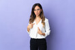 © luismolinero - Young caucasian woman isolated on purple background pointing to oneself