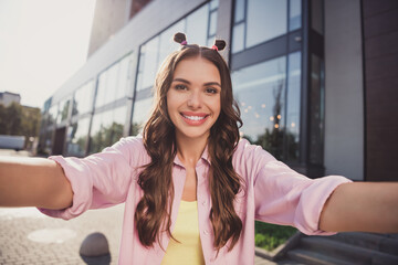 Wall Mural - Self-portrait of attractive cheerful wavy-haired girl traveling spending time having fun on fresh air outdoors