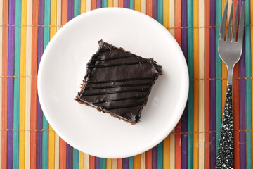 Wall Mural - slice of brownie on plate on table 