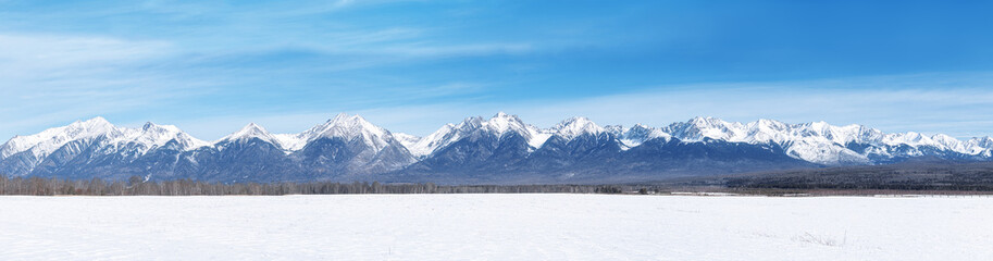 Wall Mural - Winter landscape panorama with Sayan Mountains in Siberia on sunny winter day. Natural background.