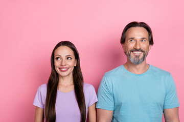 Sticker - Photo of two cheerful creative minded people look interested empty space isolated on pink color background