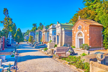 Canvas Print - Large Memorial Cemetery with its numerous mausoleums is a fine example of funeral architecture of the past, Milan, Italy