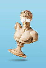 Creative Concept With Old Statue In Sunglasses On Light Blue Background. Minimal Party Concept.