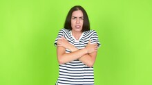 Young Brunette Woman Freezing Over Isolated Background. Green Screen Chroma Key