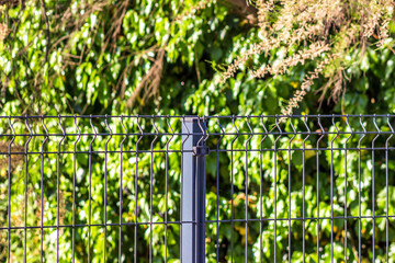 Wall Mural - Steel grating fence made with wire.
